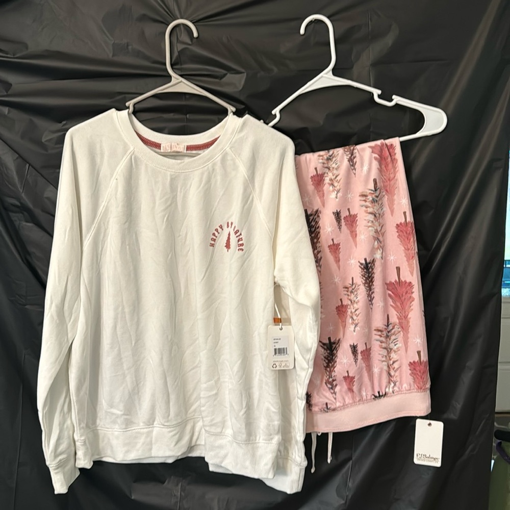 White crewneck pull over, “Happy By Nature” and pink tree pajama pants